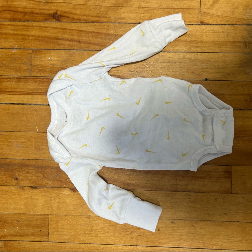 Nike bodysuit with yellow check logo